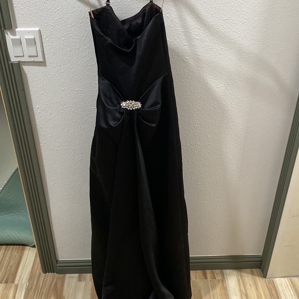 BCBGMAXAZRIA a classic strapless black formal gown.